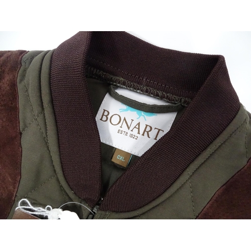 359 - Country clothing : a Bonart child's shooting gilet / waistcoat in olive green, diamond quilt with fa... 