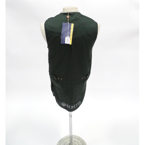 361 - Country clothing : a Beretta skeet vest / clay shooting waistcoat in black/green with silver piping,... 