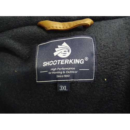 362 - Country clothing : a Shooterking Performance fleece gilet / waistcoat, in navy blue with faux leathe... 