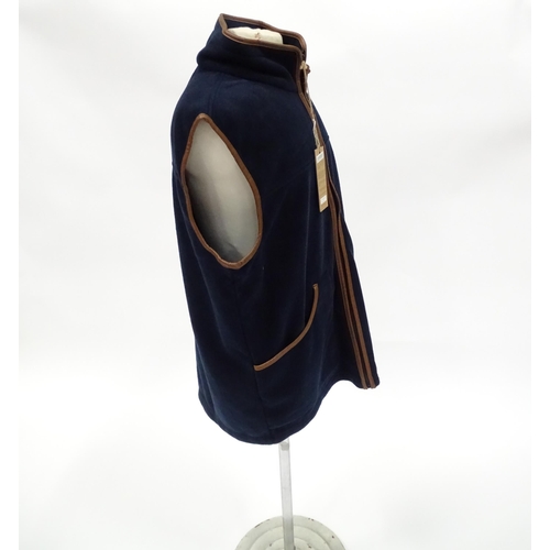 362 - Country clothing : a Shooterking Performance fleece gilet / waistcoat, in navy blue with faux leathe... 