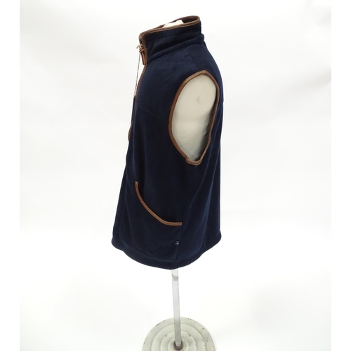 362 - Country clothing : a Shooterking Performance fleece gilet / waistcoat, in navy blue with faux leathe... 