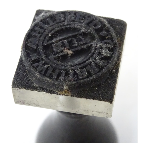 403 - A hand / desk seal and a stamp with ebonised handles. Largest approx. 2 1/2