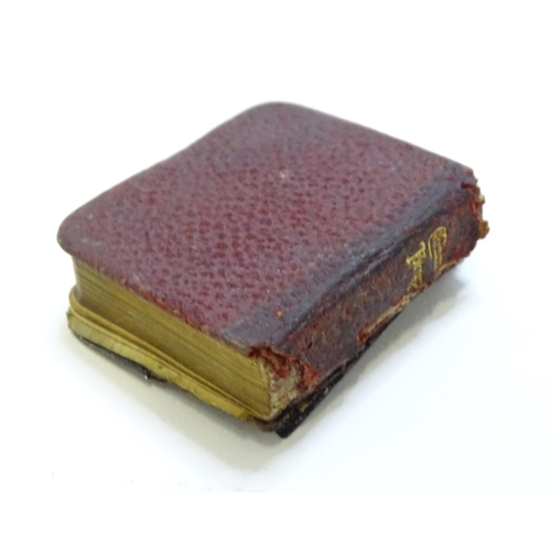 410 - A miniature prayer book with silver front cover with embossed angel detail. hallmarked Birmingham 19... 