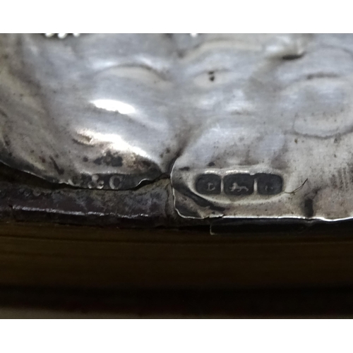 410 - A miniature prayer book with silver front cover with embossed angel detail. hallmarked Birmingham 19... 