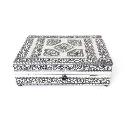 444 - An eastern style white metal jewellery box formed as two books,  with fitted sectional interior. Tog... 