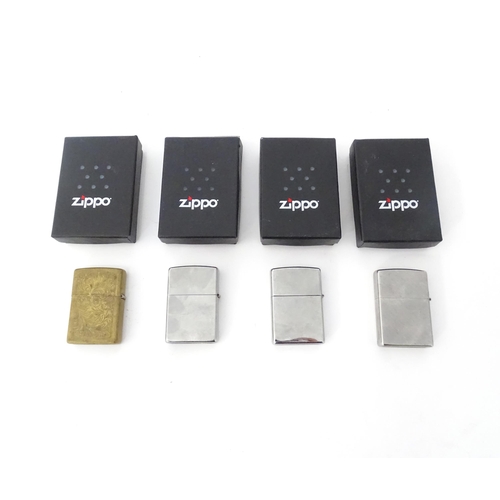 491 - Four boxed Zippo pocket lighters, including commemorative issues for the 1960 moon landing and the B... 