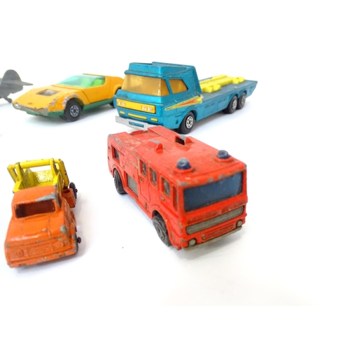 497 - Toys: A quantity of die cast scale model vehicles to include a Lesney Matchbox Merryweather Fire Eng... 