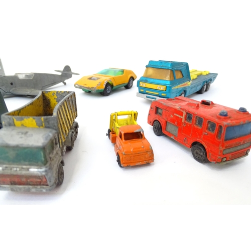 497 - Toys: A quantity of die cast scale model vehicles to include a Lesney Matchbox Merryweather Fire Eng... 