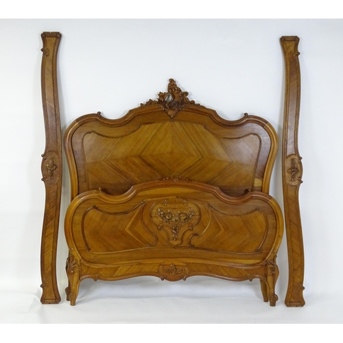 662 - An early /mid 20thC Louis XV style bed with kingwood style veneering. 78