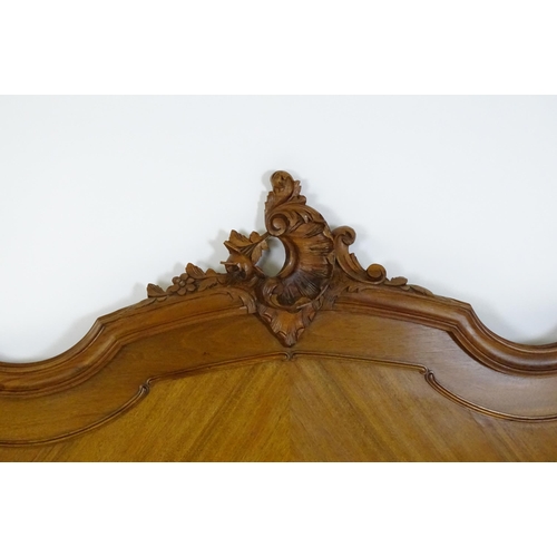 662 - An early /mid 20thC Louis XV style bed with kingwood style veneering. 78