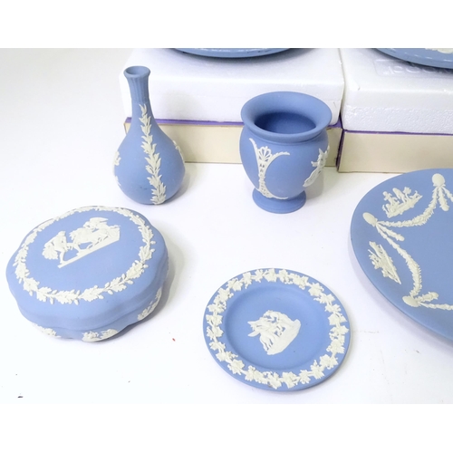 724 - A quantity of Wedgwood Jasperware to include Christmas plates, vases, candle holders, pin dishes, et... 