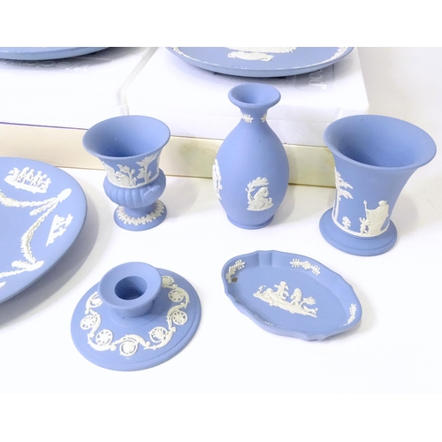 724 - A quantity of Wedgwood Jasperware to include Christmas plates, vases, candle holders, pin dishes, et... 