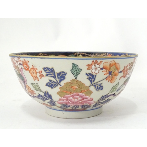 778 - An Oriental bowl decorated with flowers, foliage and birds. Approx. 4 3/4