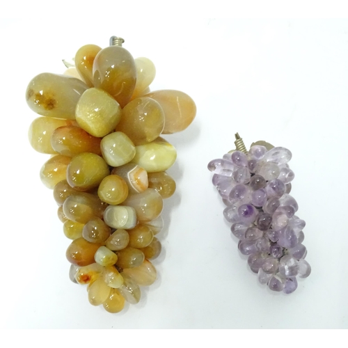 782 - A 20thC hardstone model of a bunch of grapes, together with another (2)