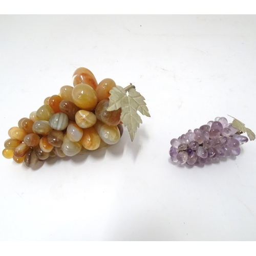 782 - A 20thC hardstone model of a bunch of grapes, together with another (2)