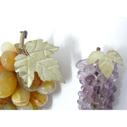 782 - A 20thC hardstone model of a bunch of grapes, together with another (2)