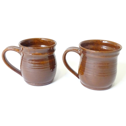 783 - A pair of studio pottery stoneware frog mugs with slipware wheat detail and frog decoration within. ... 