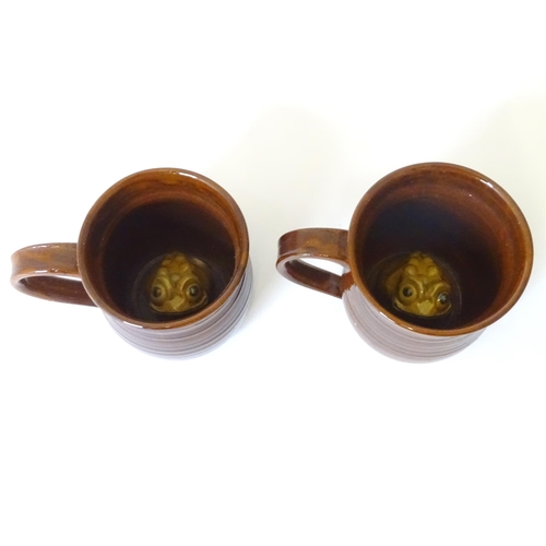 783 - A pair of studio pottery stoneware frog mugs with slipware wheat detail and frog decoration within. ... 