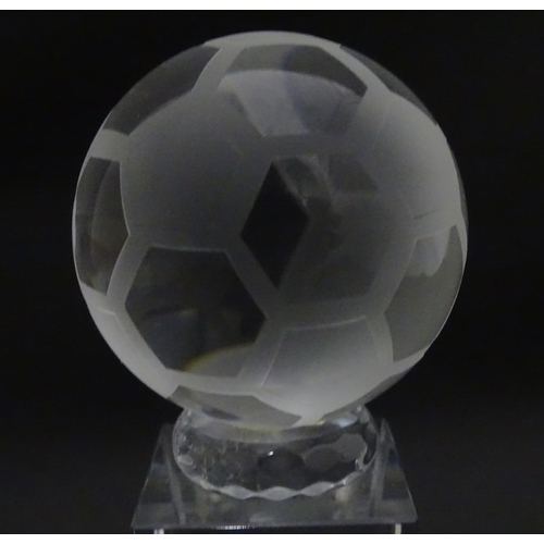 785 - A glass football trophy of tapering form with footballer detail to centre. Approx. 6 3/4