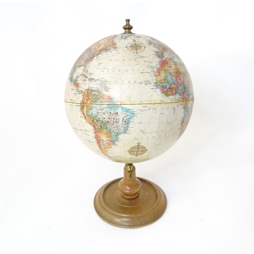 816 - A 20thC Replogle globe titled World Classic. Approx. 15