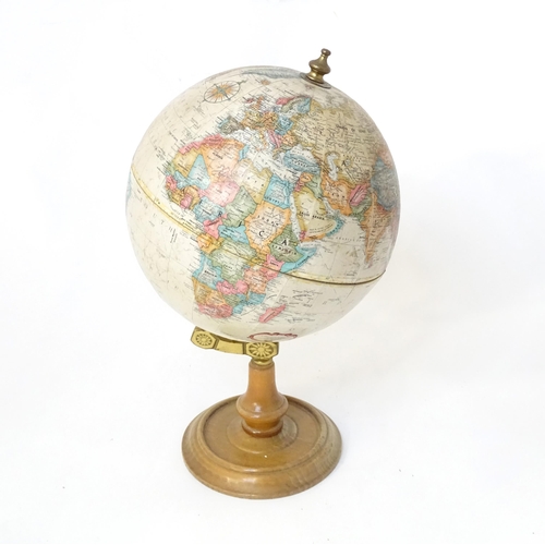 816 - A 20thC Replogle globe titled World Classic. Approx. 15