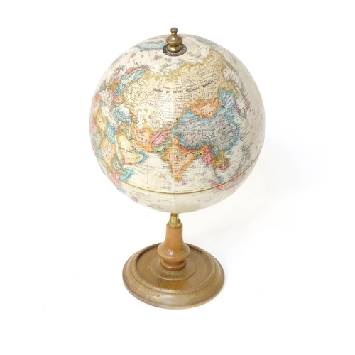 816 - A 20thC Replogle globe titled World Classic. Approx. 15