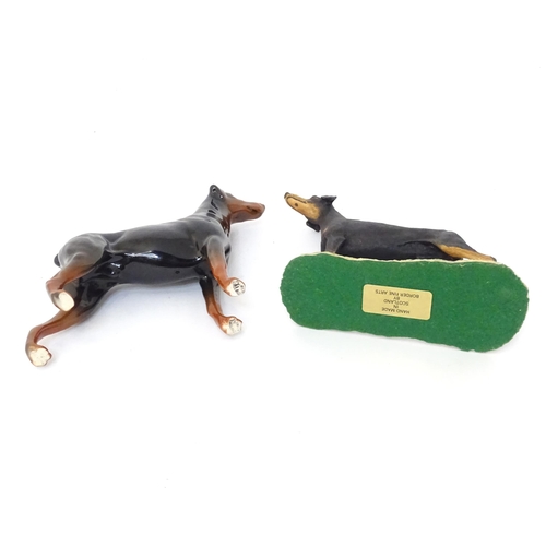 850 - A Beswick model of a Doberman dog. Together with a Border Fine Arts Doberman. (G)