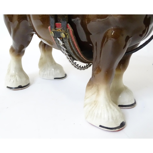 859 - A ceramic model of a dray horse with a wooden cart and barrels. Horse approx. 13 1/2