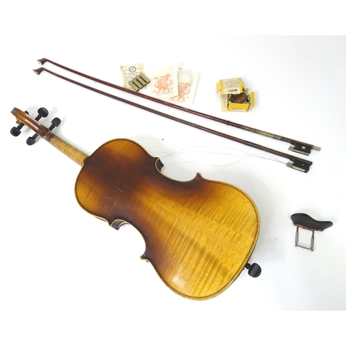 889 - A mid 20thC Bohemian violin, cased with two bows. The instrument approx 23 1/2