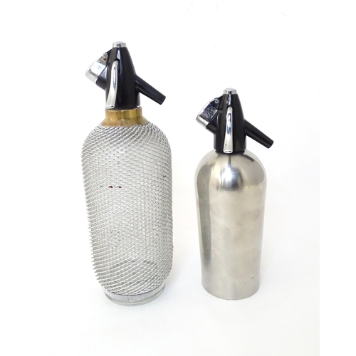 94 - Two mid to late 20thC soda siphons, the larger example with glass bottle and wire mesh cover, approx... 