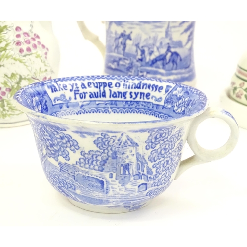 142 - Four Victorian and later ceramics to include a jug with fruiting vine detail, blue and white tankard... 