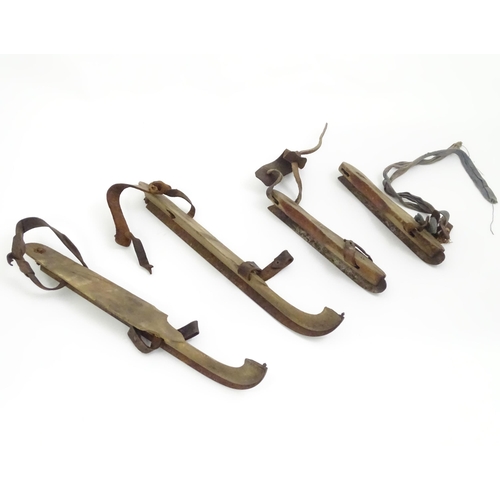 161 - Two pairs of vintage wooden ice skates