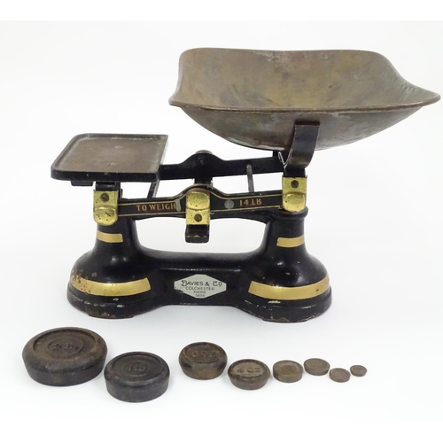 165 - Cast iron balance scales by Davies & Co. of Colchester. Together with eight weights. Approx. 11