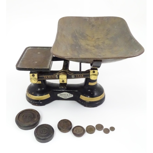 165 - Cast iron balance scales by Davies & Co. of Colchester. Together with eight weights. Approx. 11