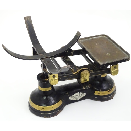 165 - Cast iron balance scales by Davies & Co. of Colchester. Together with eight weights. Approx. 11