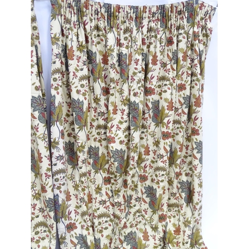 234 - Two pairs of curtains with a cream ground decorated with flowers and foliage. Together with two pelm... 