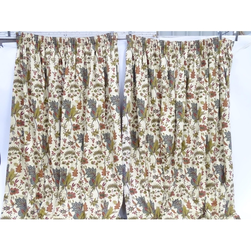 234 - Two pairs of curtains with a cream ground decorated with flowers and foliage. Together with two pelm... 