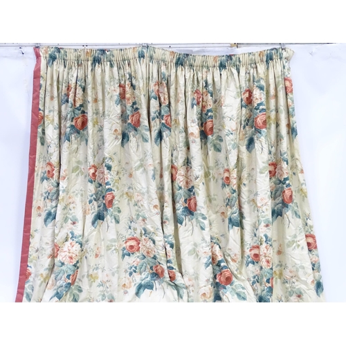 237 - A pair of curtains with a cream ground and rose decoration. Together with another pair of curtains w... 