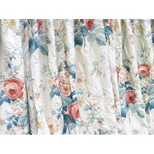 237 - A pair of curtains with a cream ground and rose decoration. Together with another pair of curtains w... 