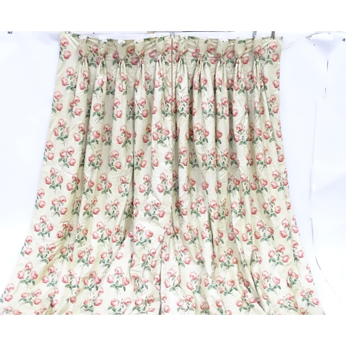 237 - A pair of curtains with a cream ground and rose decoration. Together with another pair of curtains w... 