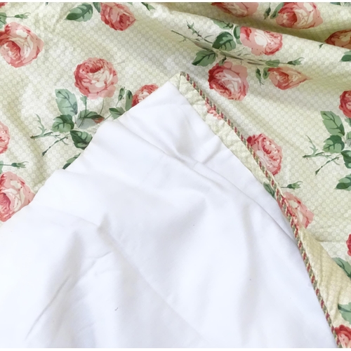 237 - A pair of curtains with a cream ground and rose decoration. Together with another pair of curtains w... 