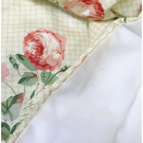 237 - A pair of curtains with a cream ground and rose decoration. Together with another pair of curtains w... 