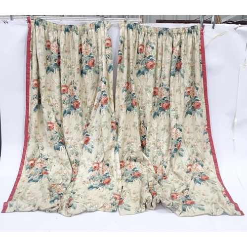 237 - A pair of curtains with a cream ground and rose decoration. Together with another pair of curtains w... 