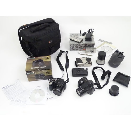 354 - A quantity of cameras, to include a boxed Fuji finepix S2500 bridge camera, together with examples b... 