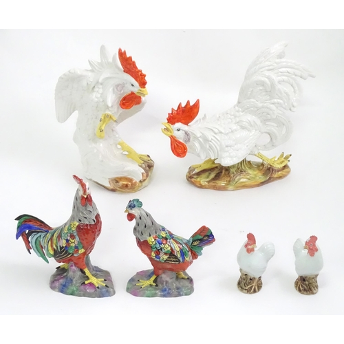 406 - A quantity of ceramic models of cockerels / chickens. Largest approx. 12