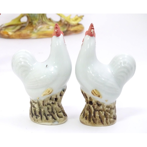 406 - A quantity of ceramic models of cockerels / chickens. Largest approx. 12