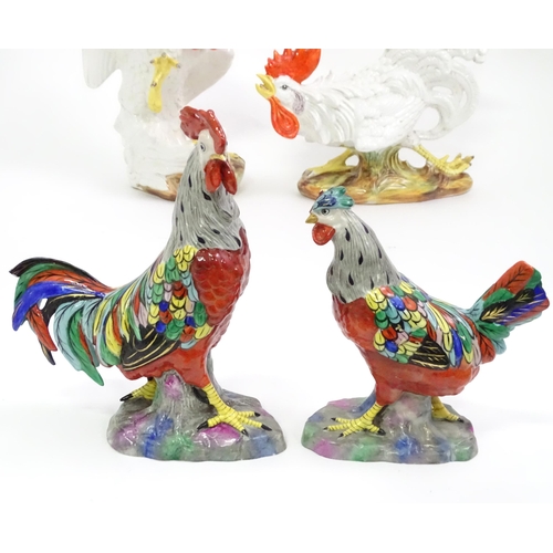 406 - A quantity of ceramic models of cockerels / chickens. Largest approx. 12