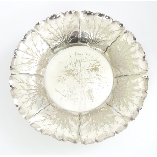 462 - A silver plate dish by Hukin & Heath of naturalistic form on three feet. Marked under and numbered 8... 