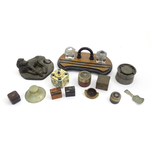 487 - A quantity of assorted items to include a standish, assorted travelling inkwells, a cast model of a ... 