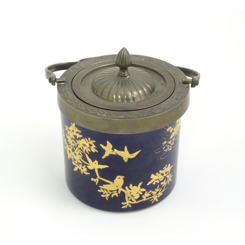 495 - A French biscuit barrel with blue ground decorated with gilt birds and flowers. Marked Limoge under.... 